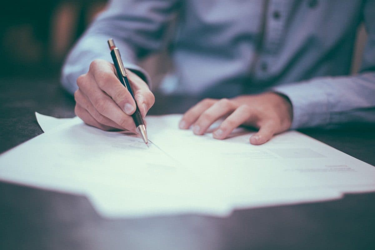 Professional meeting — documents and hands across a conference table
